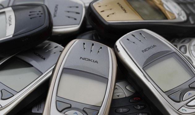 Illustration picture shows Nokia logo on used cell phones in Zurich